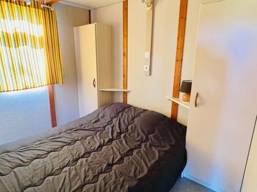 Ένα ή περισσότερα κρεβάτια σε δωμάτιο στο Chalet avec Terrasse à Camon - API-1-52-902