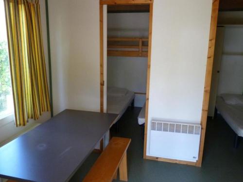 Ένα ή περισσότερα κρεβάτια σε δωμάτιο στο Chalet avec Terrasse pour 5 personnes - API-1-52-905