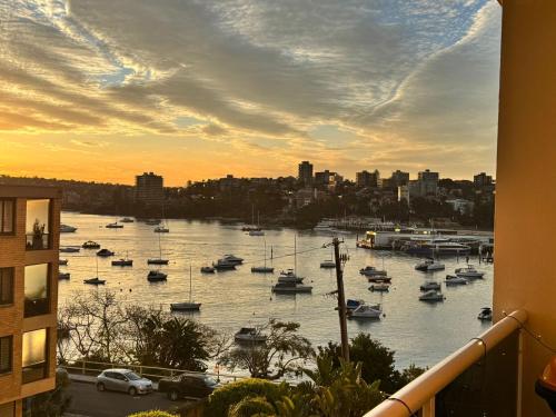 a view of a harbor with boats in the water at Waterfront Bliss Apartment in the Heart of Manly in Sydney