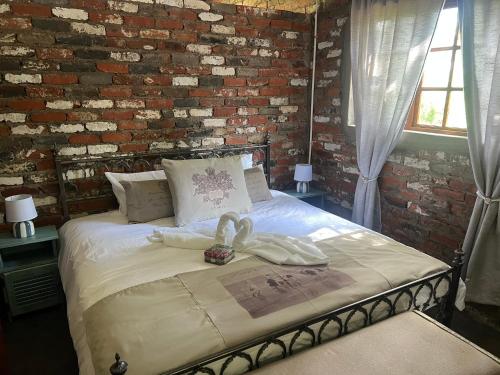 Ένα ή περισσότερα κρεβάτια σε δωμάτιο στο Vallombrosa Cottage