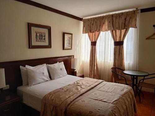 Ένα ή περισσότερα κρεβάτια σε δωμάτιο στο Hospedaje El Escudero