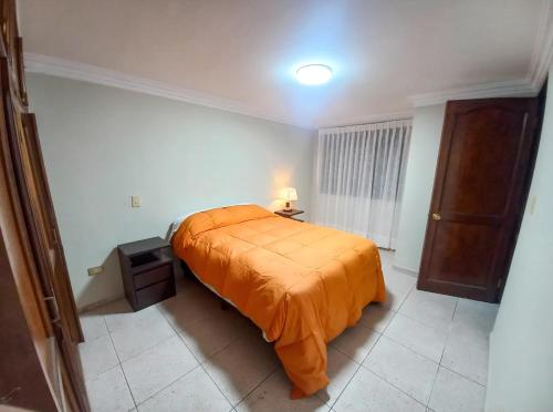 Ένα ή περισσότερα κρεβάτια σε δωμάτιο στο Departamento con Terraza