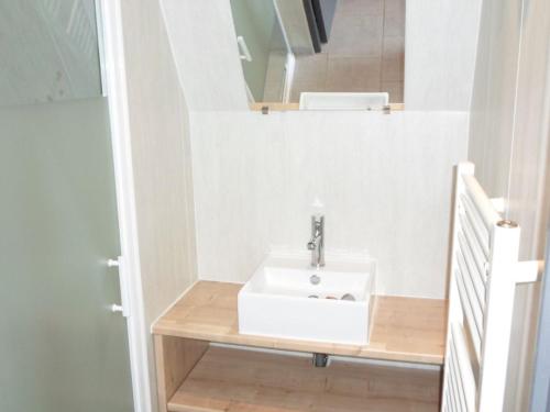 a bathroom with a sink and a mirror at Chalet pour 6 avec Terrasse - La Chapelle-devant-Bruyères - API-1-52-972 in La Chapelle