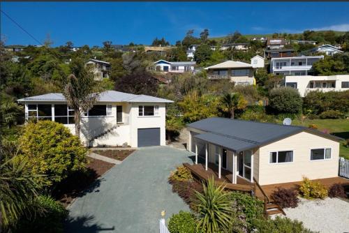 an aerial view of a house with a driveway at Best of Both Worlds Between City & Sea Holiday House in Nelson