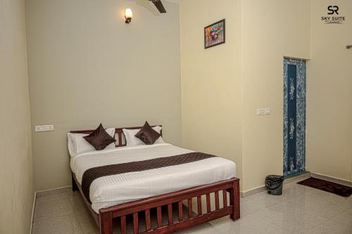 a bedroom with a bed in a room at sky suite residency in Auroville