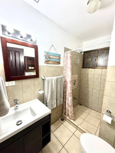 a bathroom with a sink and a shower at Cocomarindo Breeze Condo and Amazing Pool in Coco