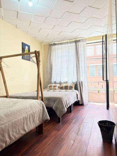 Postel nebo postele na pokoji v ubytování Aquisito Nomas Es