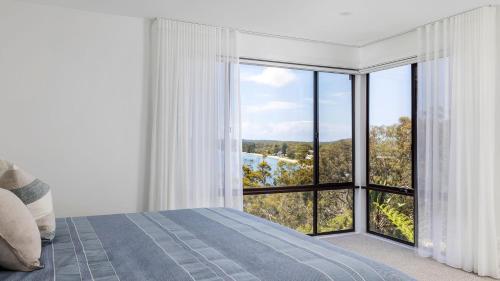 Postel nebo postele na pokoji v ubytování By The Bay