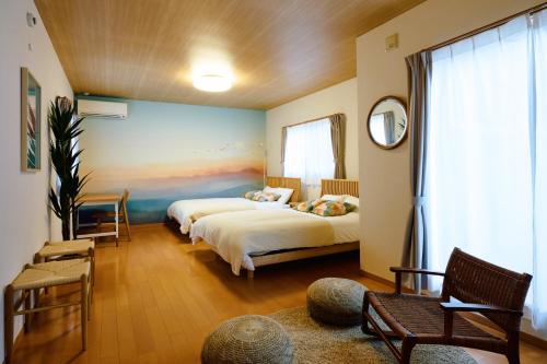 Postel nebo postele na pokoji v ubytování Oneness House Kumamoto2 熊本新町