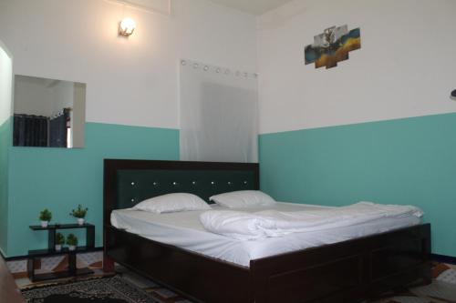 Ένα ή περισσότερα κρεβάτια σε δωμάτιο στο Morning Mist Home stay