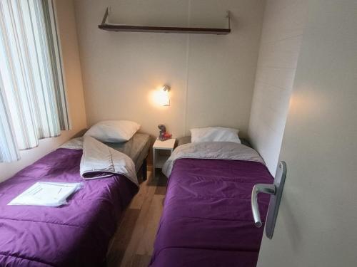 Una cama o camas en una habitación de Mobil home avec terrasse à Mauléon-Licharre - API-1-52-1096