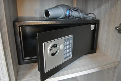 a microwave oven with a camera on top of it at Hotel Tropicana in Blankenberge