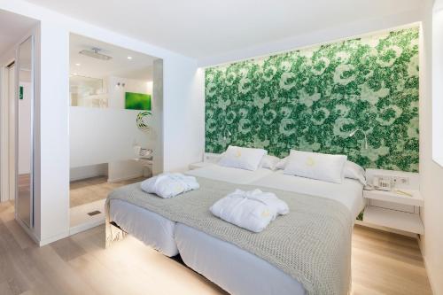 Ліжко або ліжка в номері Sud Ibiza Suites