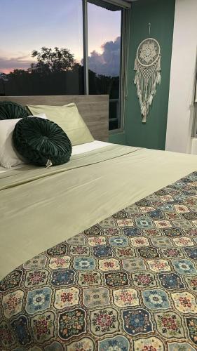 a bedroom with a bed with a patterned floor at Yopo Resort in Yopal
