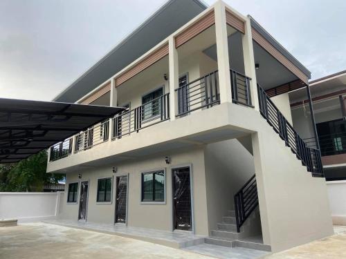 a building with balconies on the side of it at ZAMZAM House in Thalang