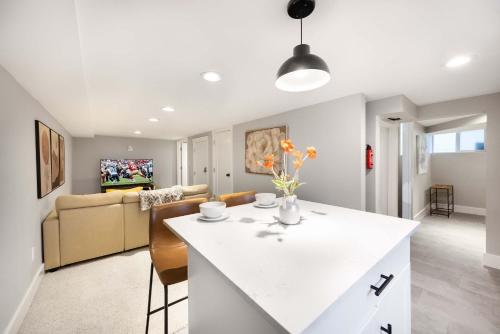 a kitchen and living room with a white counter top at Renton DT 1BR Suite WS 95 Near Landing &Sea-Tac in Renton