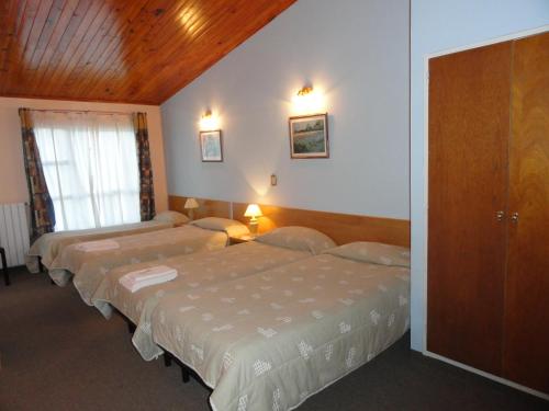 Ένα ή περισσότερα κρεβάτια σε δωμάτιο στο Hotel Sehuen