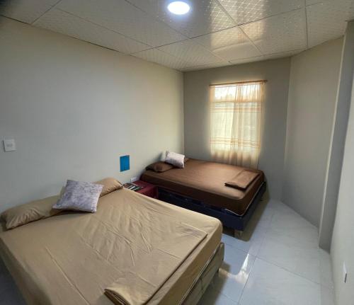 Ένα ή περισσότερα κρεβάτια σε δωμάτιο στο San Cristóbal Surfing House 1