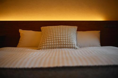 Postel nebo postele na pokoji v ubytování Residence Hotel Hakata 3