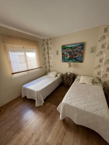 Llit o llits en una habitació de Salvador Rueda