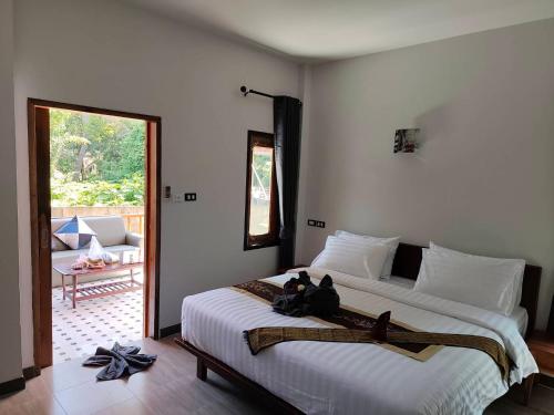 Ένα ή περισσότερα κρεβάτια σε δωμάτιο στο Bua sawan poolvilla kohlanta