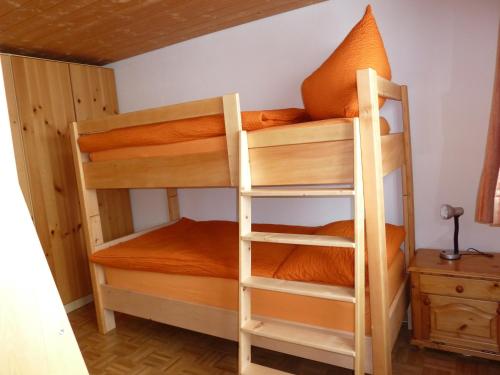 a bunk bedded room with two bunk beds at Ferienwohnung Stoffel in Cresta