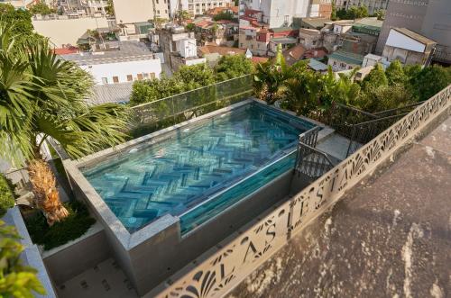 a swimming pool on top of a building at La Siesta Premium Lakeside in Hanoi