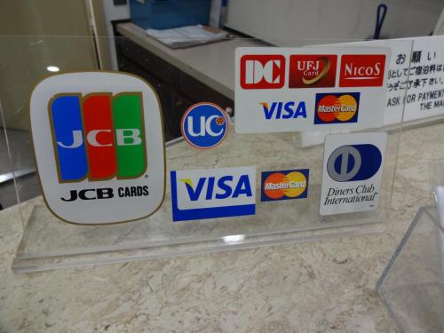 a bunch of signs on a counter in a store at Hotel Koshien in Nishinomiya