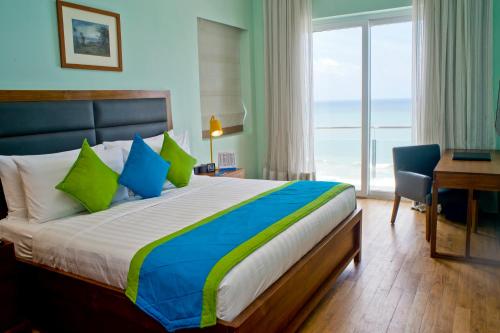 Ένα ή περισσότερα κρεβάτια σε δωμάτιο στο Ocean Edge Suites & Hotel Colombo