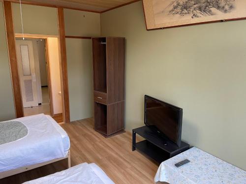 Postel nebo postele na pokoji v ubytování 安房リゾート旅館 臨海臥龍