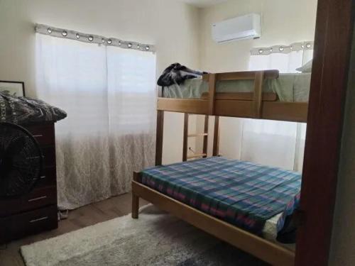 Ένα ή περισσότερα κρεβάτια σε δωμάτιο στο Garifuna Shores Guest Suite