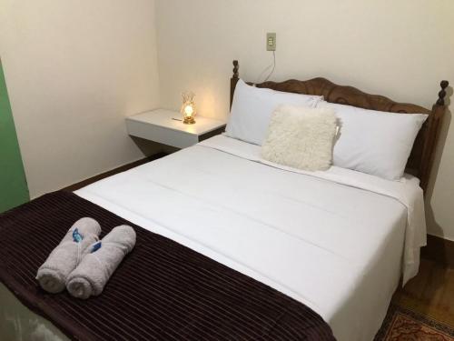 Ένα ή περισσότερα κρεβάτια σε δωμάτιο στο Hostel da Dri