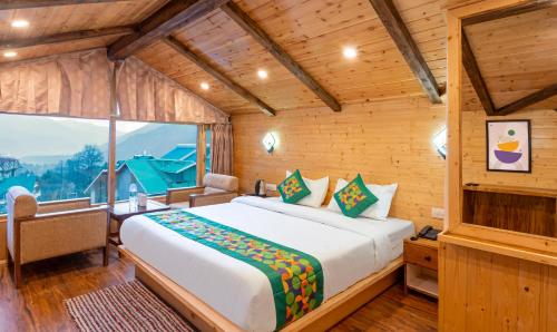 Ένα ή περισσότερα κρεβάτια σε δωμάτιο στο Treebo M R Villa