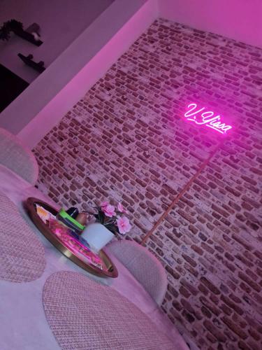 a neon sign on the floor of a room at Villa Yissa en Prado Del Rey, Cádiz con WIFI in Prado del Rey
