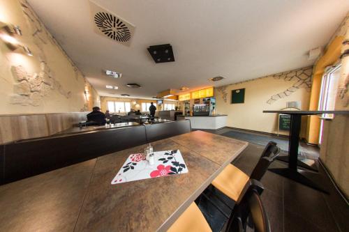 a restaurant with a table with a napkin on it at Hollis Rast in Sangerhausen