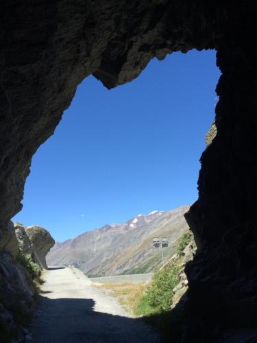 a view of a road through a cave at Haus Alpenstern in Saas-Grund