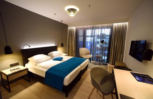 Télévision ou salle de divertissement dans l'établissement Radisson Blu Hotel, Mannheim