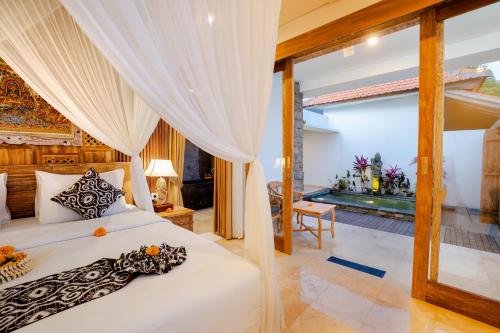 Postel nebo postele na pokoji v ubytování Kudesa Bali