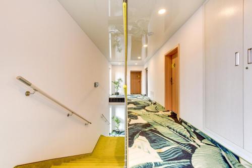 a staircase in a house with a stair case at Baltic Sands in Hel