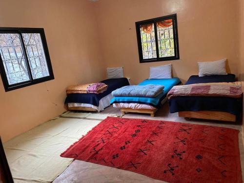 Un pat sau paturi într-o cameră la riad dar imlil