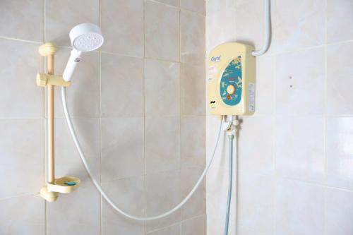 a shower in a bathroom with aitizer at DD House Apartment in Bangkok