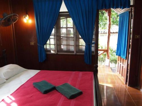 Ένα ή περισσότερα κρεβάτια σε δωμάτιο στο Palm Point Village