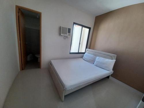 Ένα ή περισσότερα κρεβάτια σε δωμάτιο στο 88 Residences