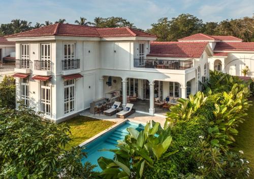 an aerial view of a house with a swimming pool at LohonoStays Villa Beleza C in Oxel