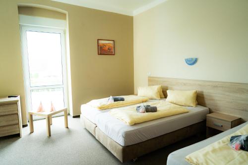 Postel nebo postele na pokoji v ubytování Holiday Centrum