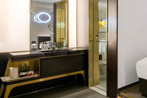 a bathroom with a sink and a mirror at CitiGO Hotel, South Gate of Xi'an Bell Tower in Xi'an