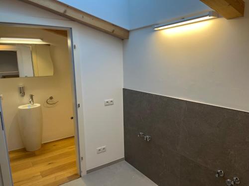 a bathroom with a toilet and a sink in a room at Panorama Quartier Seefeld in Seefeld in Tirol