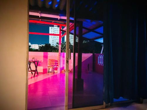 a view of a room with pink lights on the floor at Hotel Coralite Suites Lions in Santa Marta