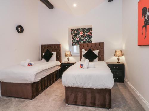 Ένα ή περισσότερα κρεβάτια σε δωμάτιο στο 7 Holly Barn