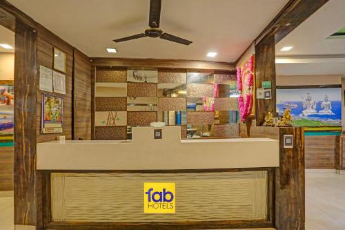 a fast food restaurant with a ceiling fan at FabHotel Tanvi Grand in Visakhapatnam